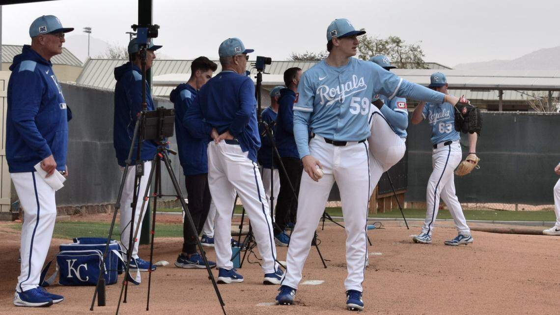 Kansas City Royals right-handed pitcher Ben Kudrna, in front at right, throws bullpen session during the club’s spring training workout in Surprise, Arizona on Wednesday, Feb. 12, 2025.