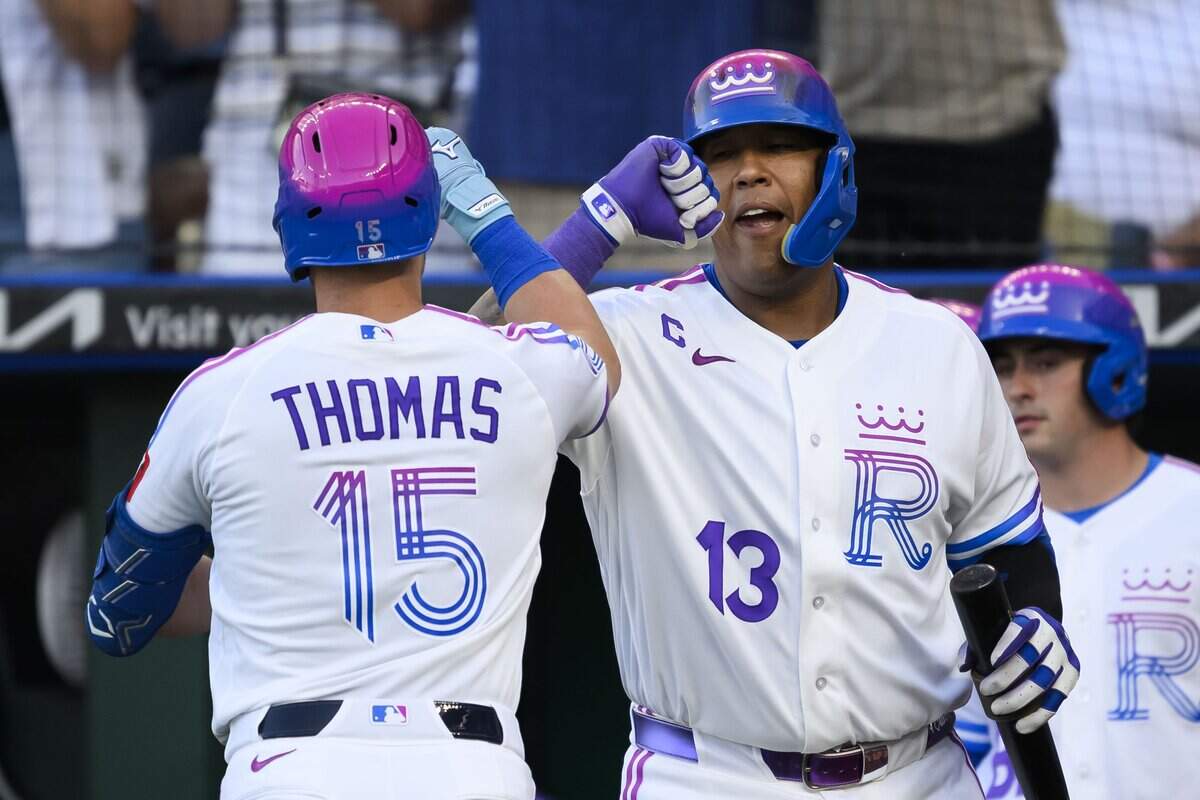 KANSAS CITY, MISSOURI - JULY 17: Lane Thomas #15 of the Kansas City Royals is congratulated after hitting a home run against the San Diego Padres by teammate Salvador Perez #13 of the Kansas City Royals during the second inning at Kauffman Stadium on July 17, 2026 in Kansas City, Missouri. (Photo by Reed Hoffmann/Getty Images)
