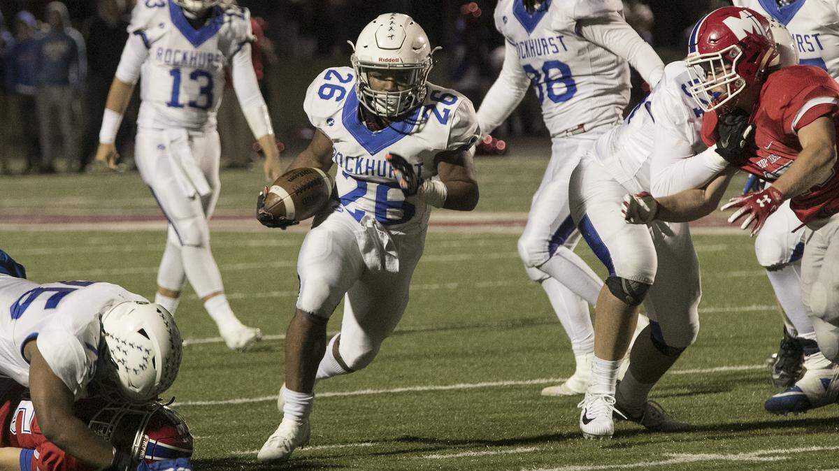 Rockhurst’s Michael Johnson ran through a big hole against Bishop Miege on Friday night at Bishop Miege. Rockhurst won 14-13.