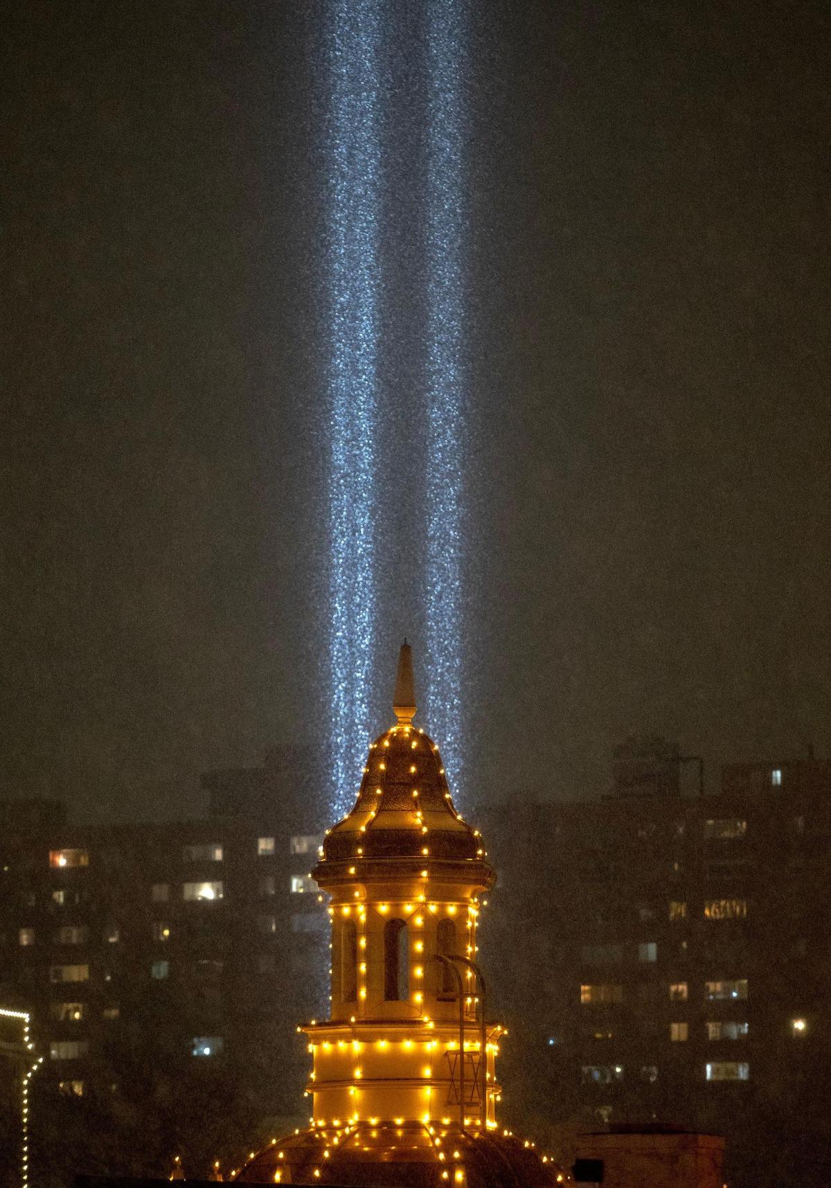 The Plaza Lights shine brightly as the season’s first snow falls on Saturday, Nov. 25, 2023, in Kansas City.