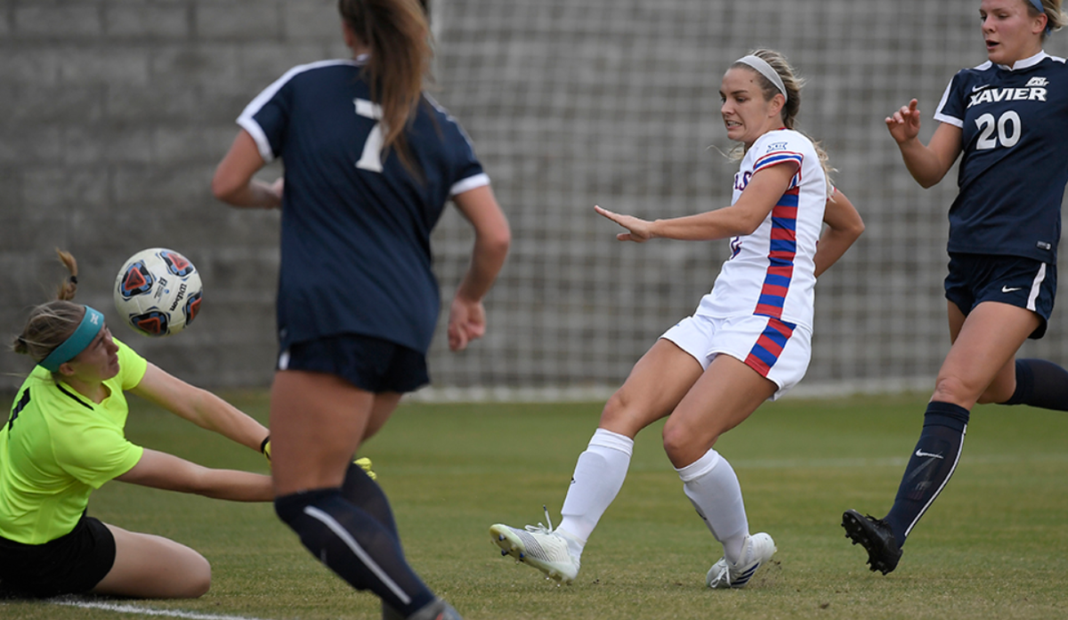 Katie McClure, second from right, scores one of her three goals Friday against Xavier in the NCAA women’s soccer tournament in Columbia, South Carolina.