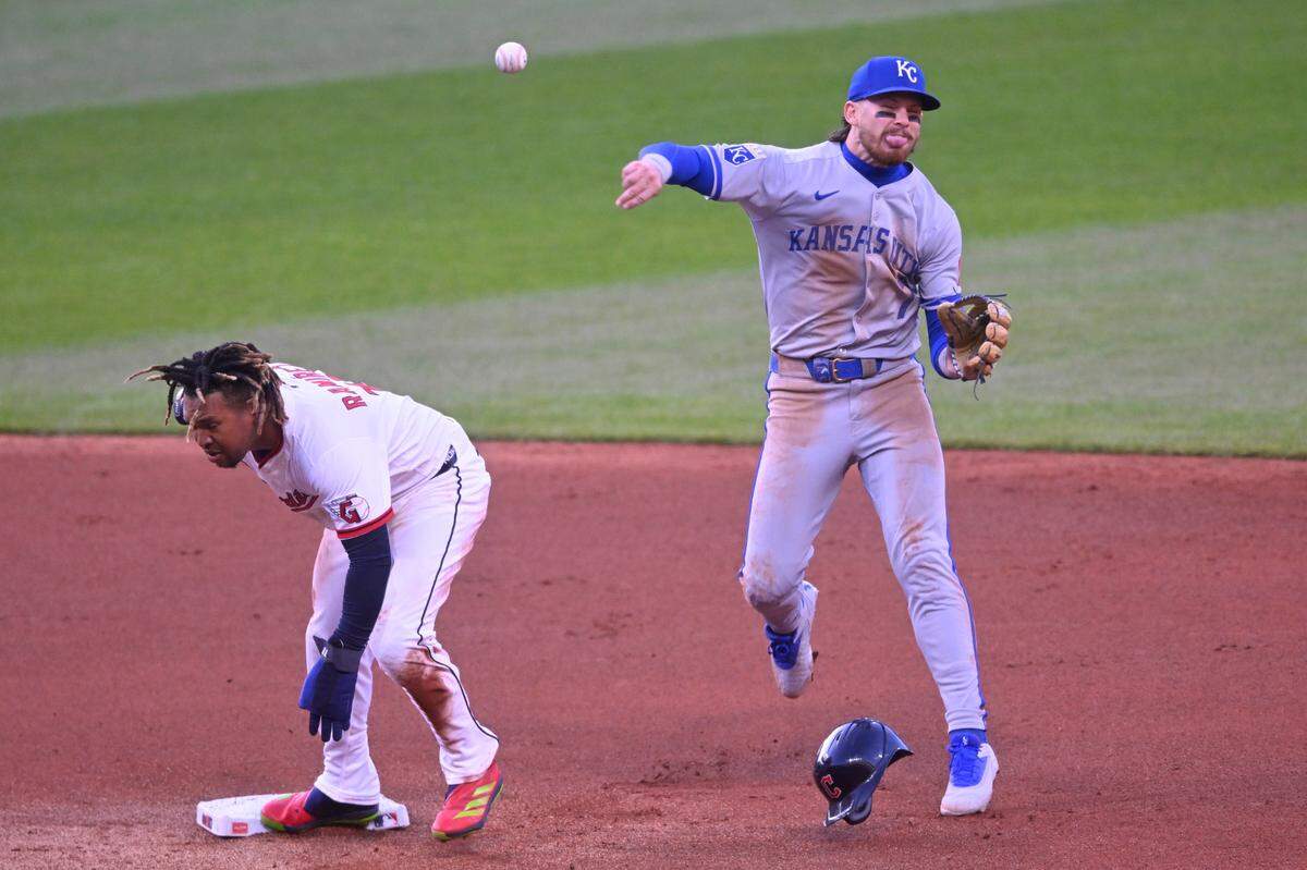 Kansas City Royals shortstop Bobby Witt Jr. (7) throws to first base after forcing out Cleveland Guardians third baseman Jose Ramirez (11) in the fourth inning at Progressive Field on April 12, 2025.