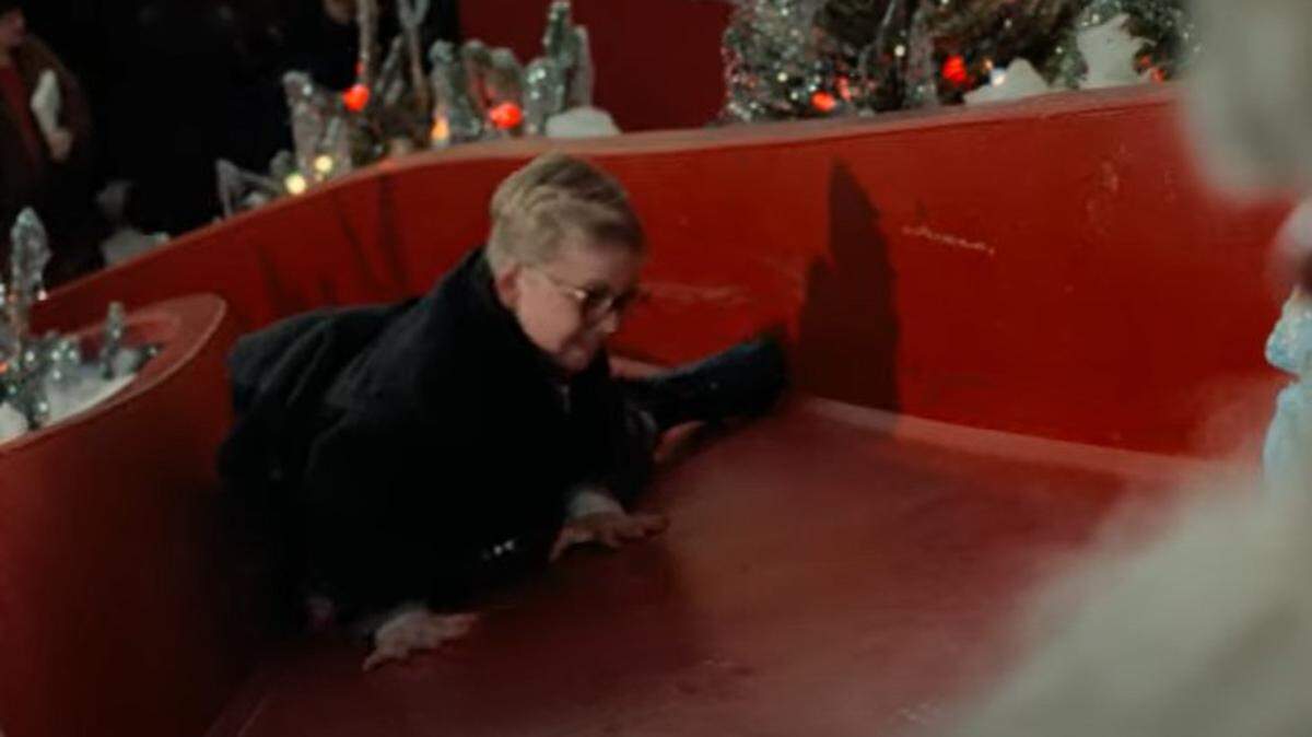 Ralphie climbed back up the slide to let Santa Claus know the real present he wanted for Christmas.