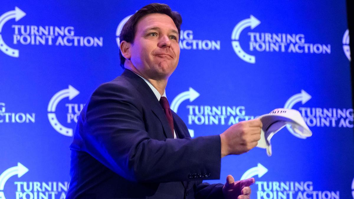 Florida Gov. Ron DeSantis threw autographed hats to the crowd as he came on stage at the Turning Point Action rally Sunday at the Embassy Suites in Olathe. He was there to campaign for Attorney General Derek Schmidt, the Republican candidate for Kansas governor.