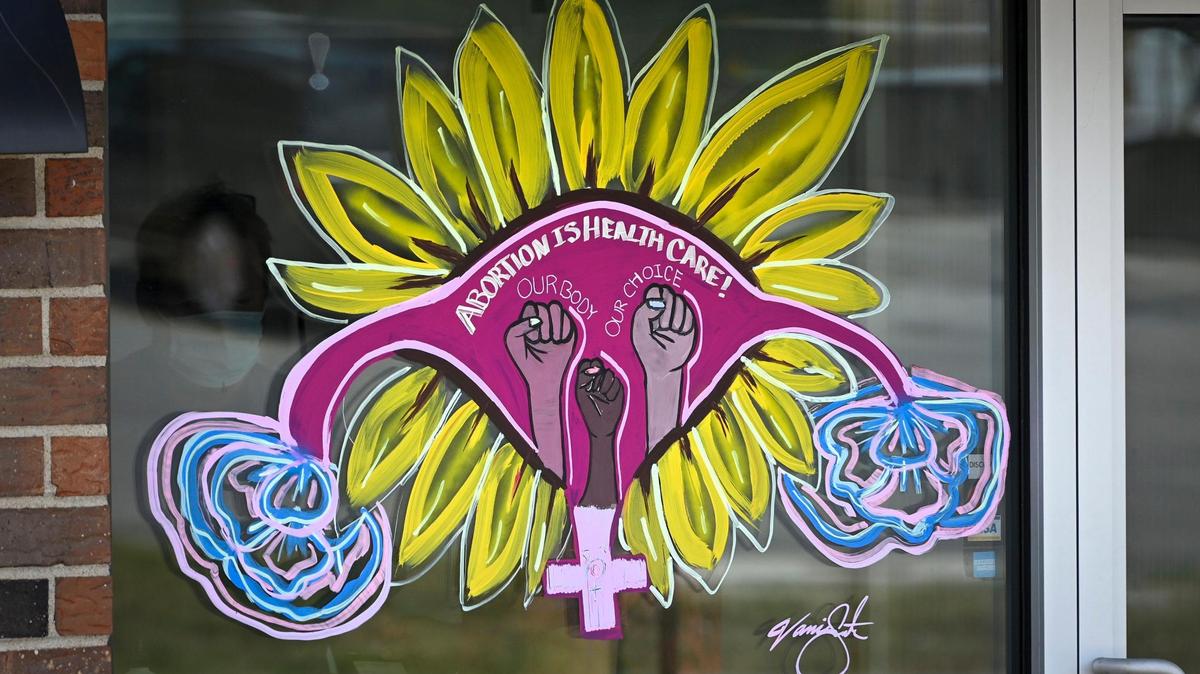 A mural saying, “Abortion is Health Care” adorns the front window of the new Planned Parenthood health center in Kansas City, Kansas. The clinic, by coincidence, opened the same week in June when the Supreme Court struck down Roe v. Wade.