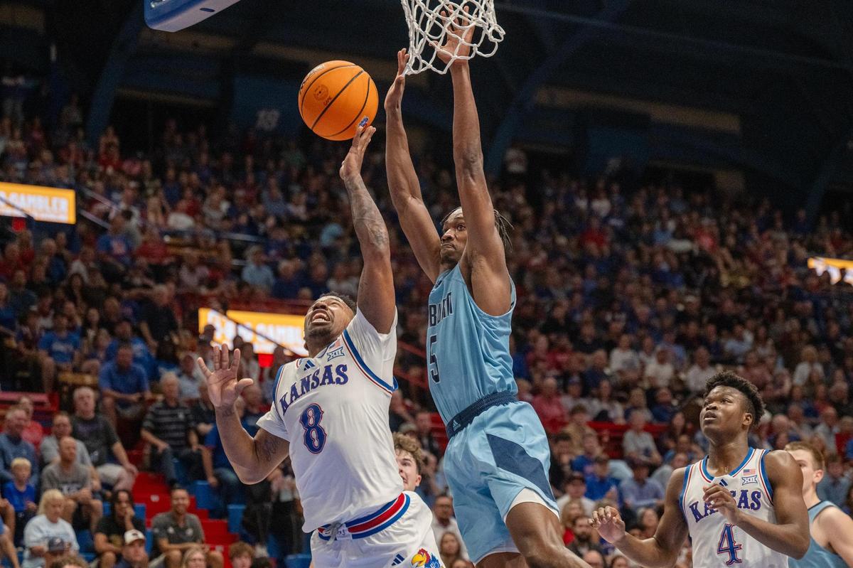 Kansas Jayhawks guard David Coit (8) goes up for a shot against the Washburn Ichabods’ Jacob Hanna (5) in the first half on Tuesday, Oct. 29, 2024, in Allen Fieldhouse in Lawrence.