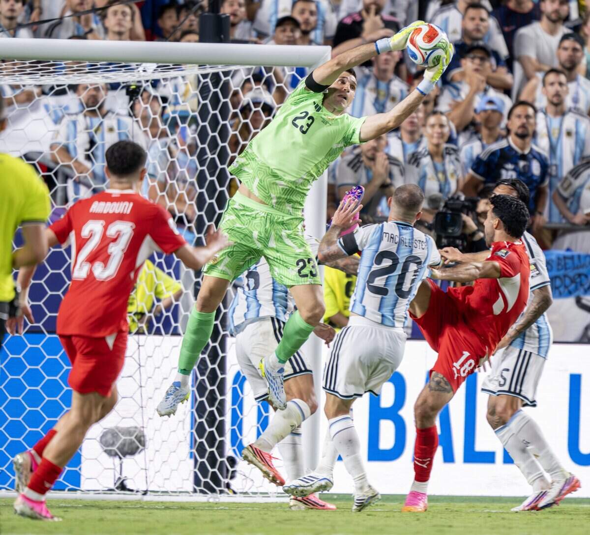 Argentina goalkeeper Emiliano Martínez (23) makes a save during overtime against Switzerland in the FIFA World Cup quarterfinal at Kansas City (Arrowhead) Stadium on Saturday, July 11, 2026.