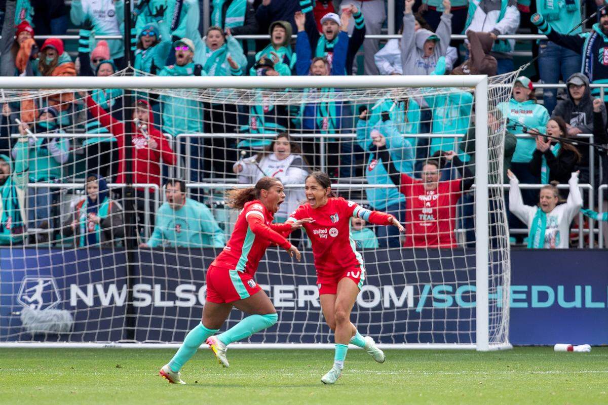 Kansas City Current forward Michelle Cooper (left) celebrates with Lo’eau LaBonta (10) after scoring a goal against the Portland Thorns in the first half at CPKC Stadium on March 15, 2025.