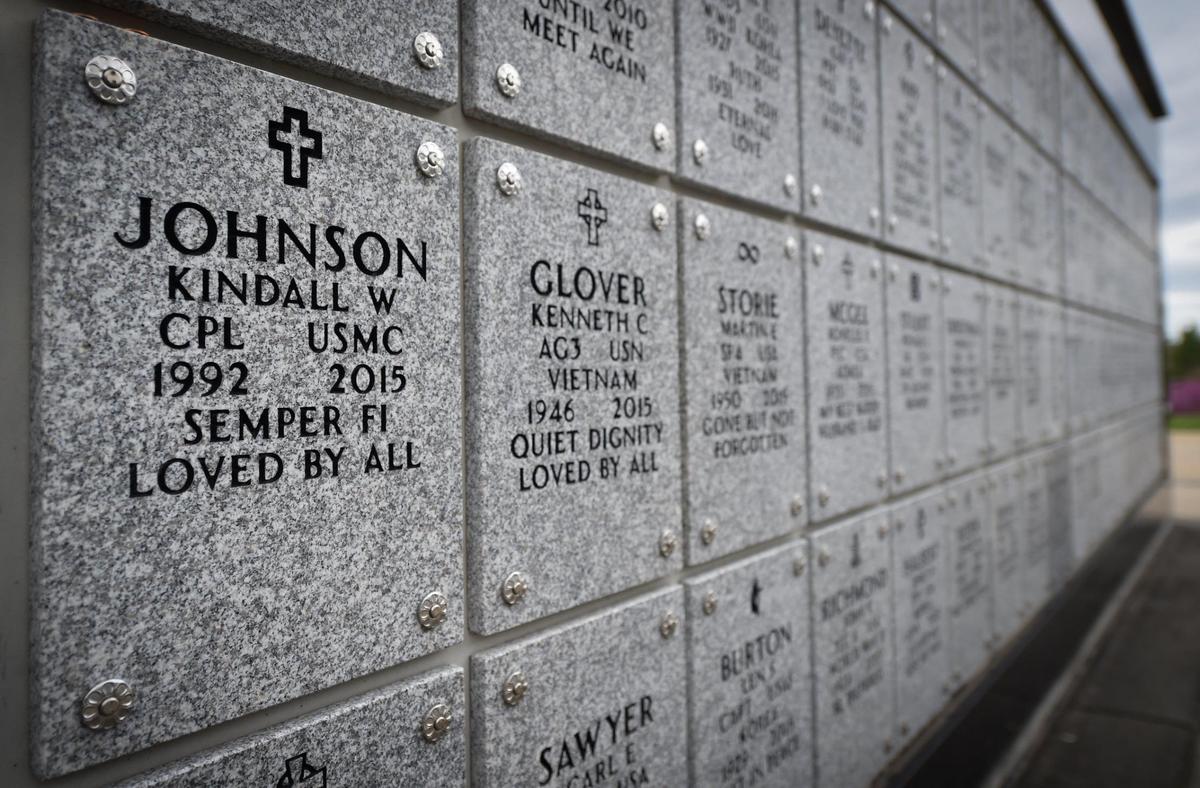 The marker of Cpl. Kindall Johnson, a veteran of the U.S. Marine Corps, who killed himself with two bullets to the heart outside a police station in 2015 in Springfield, Missouri. After a back injury, Johnson, 22, was medically retired from the Marine Corps. He was interred with full military honors at the Missouri Veterans Cemetery in Springfield.