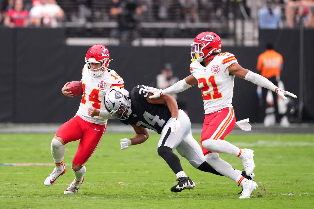 Kansas City Chiefs punter Matt Araiza (14) runs the ball on a fake as Las Vegas Raiders guard Connor Heyward (34) pursues him during a Week 4 NFL game at Allegiant Stadium in Paradise, Nev., Sunday, Oct. 4, 2026.
