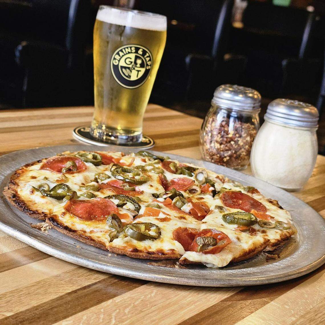 The local taproom’s menu features pizza, appetizers and salads as well as beer, wine and cocktails.