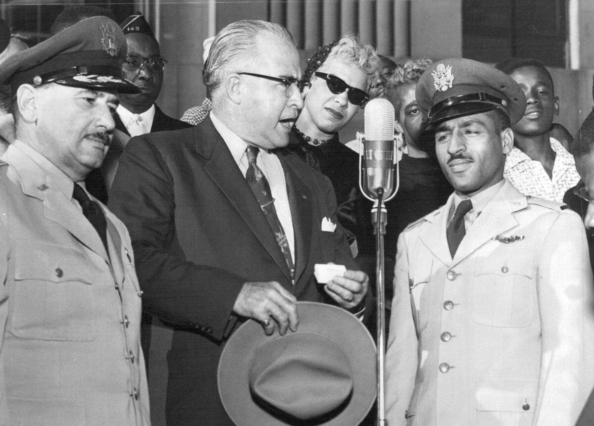 U.S. Air Force Lt. Dayton W. Ragland, right, received a key to Kansas City from Councilman Harry S. Davis on the south steps of City Hall in 1953. The highly decorated Ragland, who later went missing in action in Vietnam, inspired Ed Dwight Jr. to become a pilot when he saw his image in the Kansas City Call.