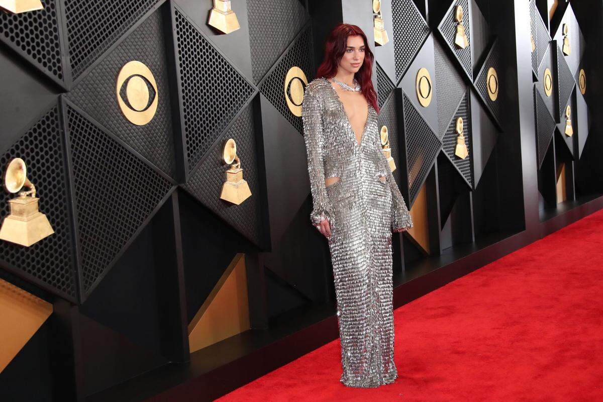 Dua Lipa in another metallic look on the Grammy Awards red carpet at Crypto.com Arena in Los Angeles.