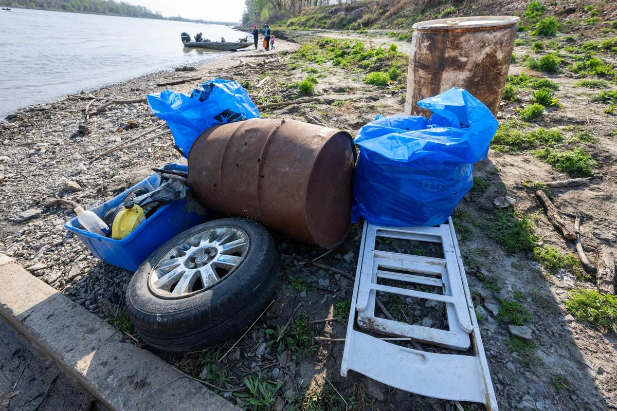 Trash is piled along the banks of the Missouri River during cleanup event held by Missouri River Relief on April 12, 2025. Volunteers rode boats down the river to various locations along the banks to clean up litter and trash.