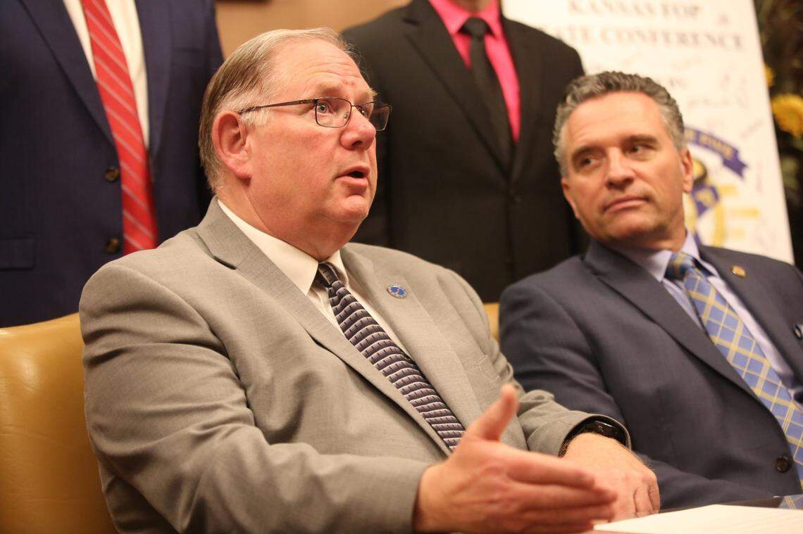Kansas House Speaker Dan Hawkins, left, a Wichita Republican, speaks with reporters along with Senate President Ty Masterson, an Andover Republican.