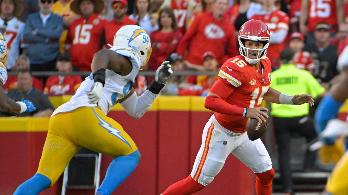 Los Angeles Chargers linebacker Chris Rumph II (94) pressures Kansas City Chiefs quarterback Patrick Mahomes (15) in the second half against on Sunday, Oct. 22, 2023, at GEHA Field at Arrowhead Stadium.