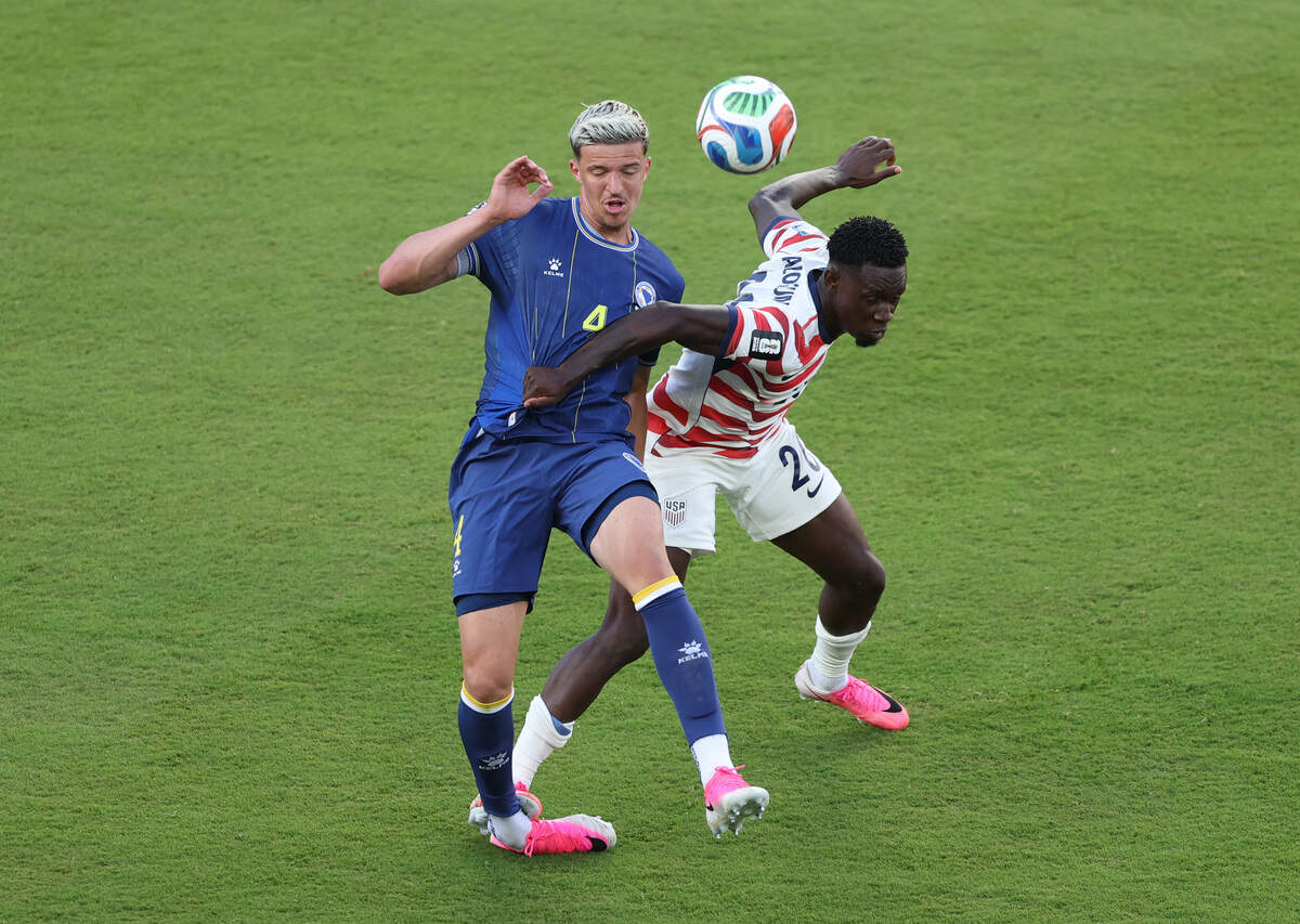 Folarin Balogun #20 of the United States fouls Tarik Muharemovic #4 of Bosnia and Herzegovina, which is later reviewed by VAR and elevated to a red card, during the FIFA World Cup 2026 Round of 32 match between USA and Bosnia and Herzegovina at San Francisco Bay Area Stadium on July 1, 2026 in Santa Clara, California.