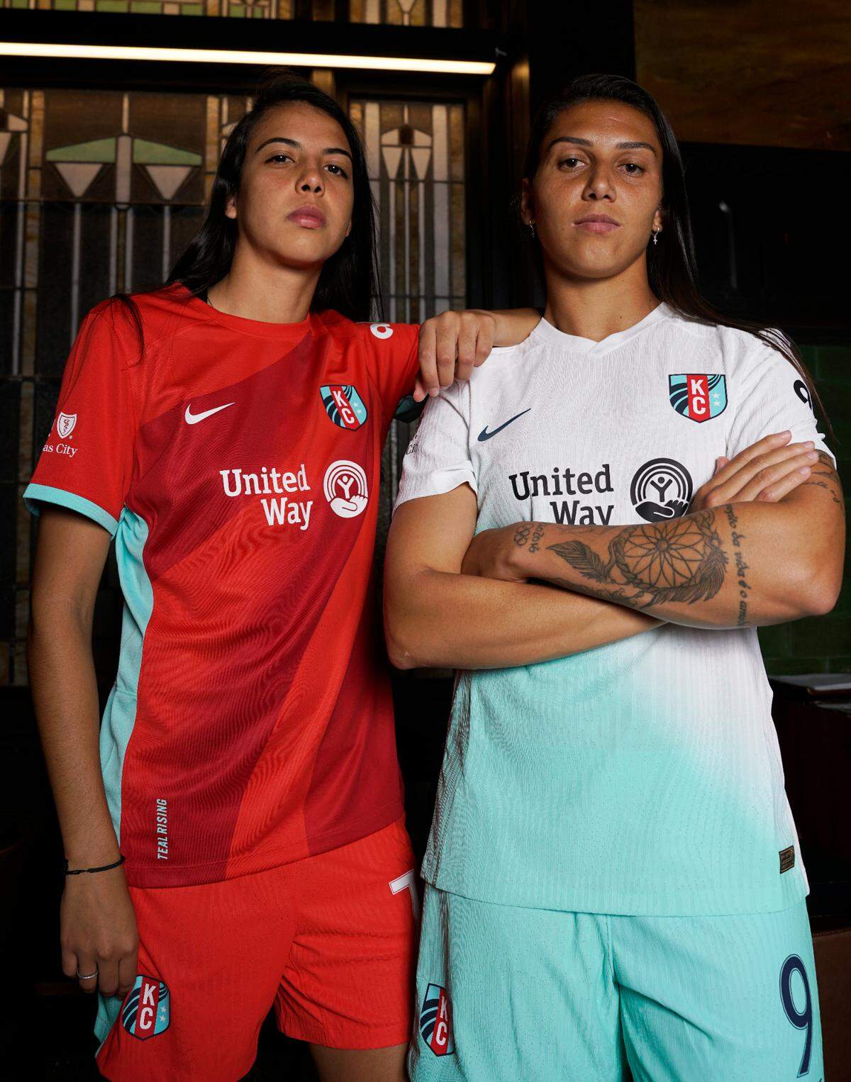 A first look at the KC Current jerseys, worn by Lauren (red) and Bia (white/teal).