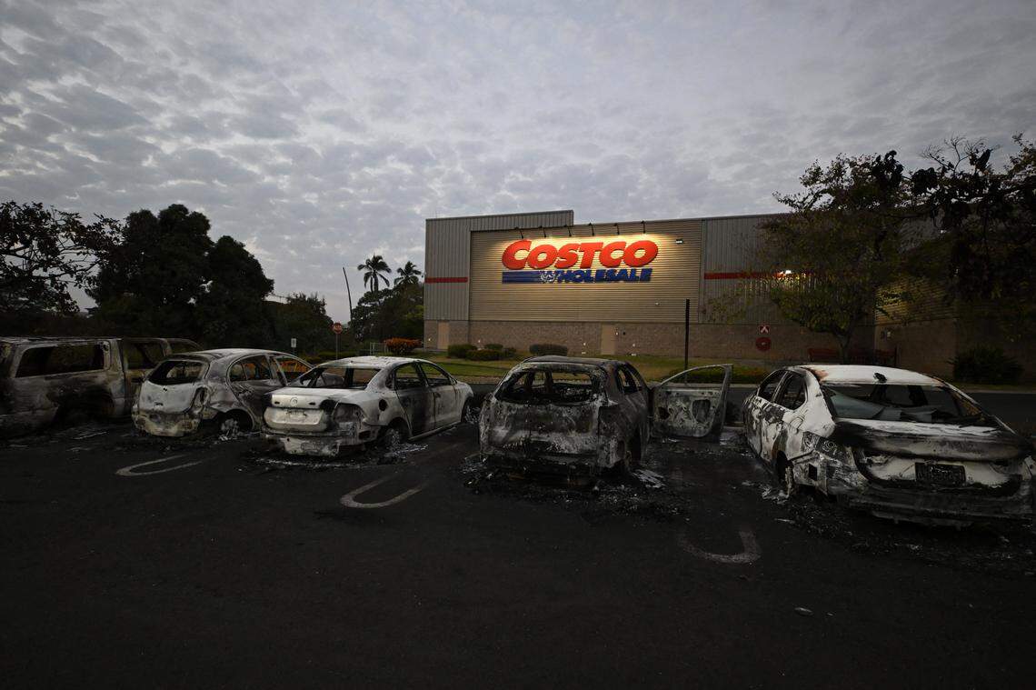 Burned cars are seen in the parking lot of a Costco retail store in Puerto Vallarta, Jalisco state, Mexico, on February 23, 2026.