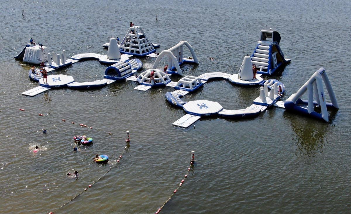 Aqua Park, a floating obstacle course, is available at Lake Olathe Swim Beach.