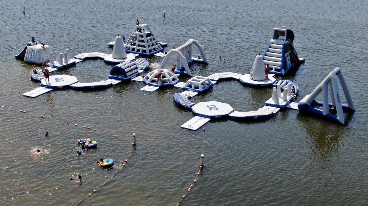 Aqua Park, a floating obstacle course, is available at Lake Olathe Swim Beach.