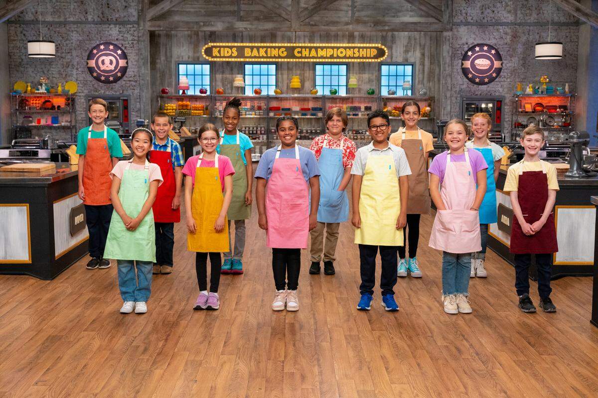 Piper Lowe of Kansas (blue apron, far right, back row) on the set of Kids Baking Championship. The show as filmed over the summer.
