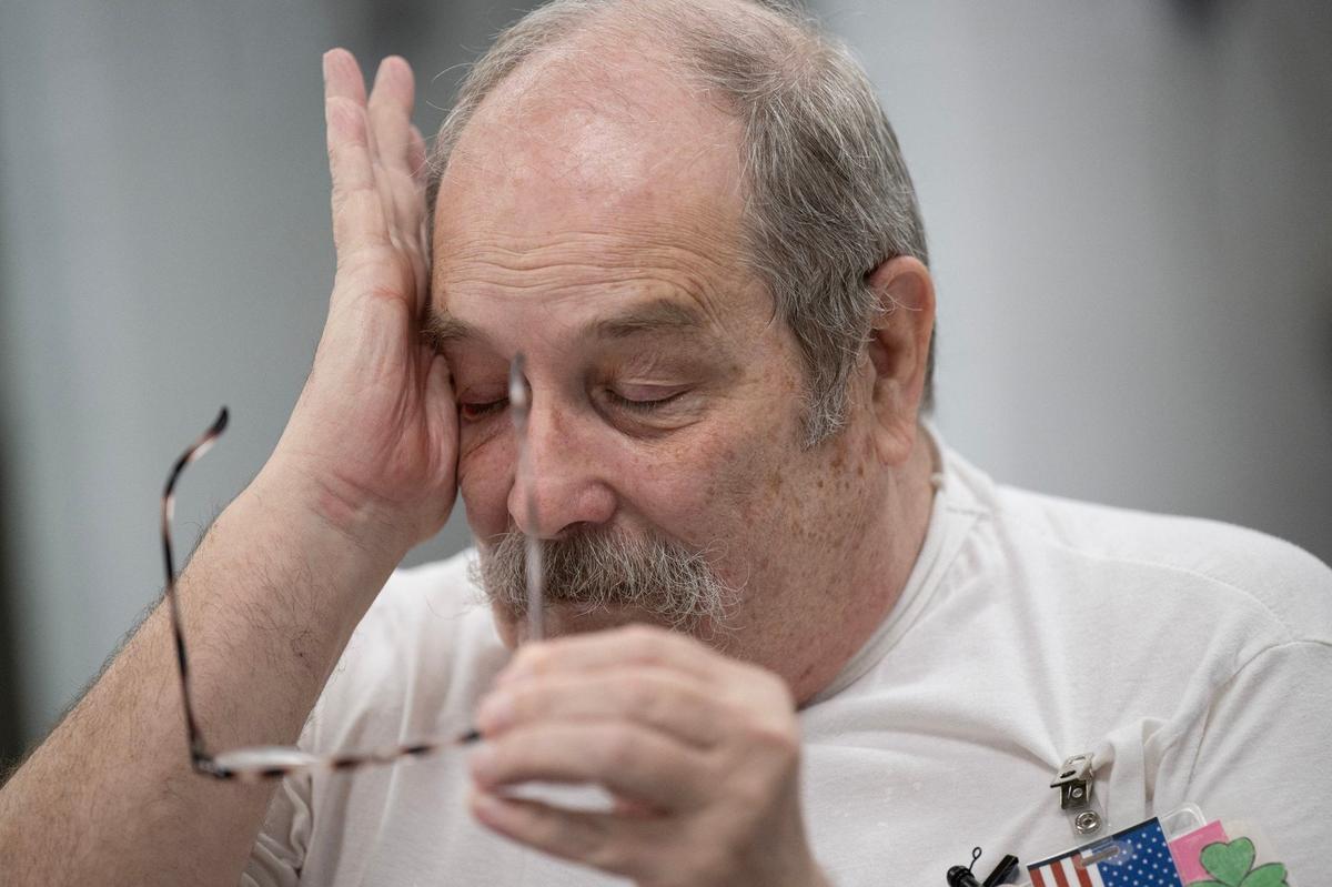 David Hosier wipes away tears after speaking about his life experiences during an interview at Potosi Correctional Center on Tuesday, May 21, 2024, in Potosi, Missouri.