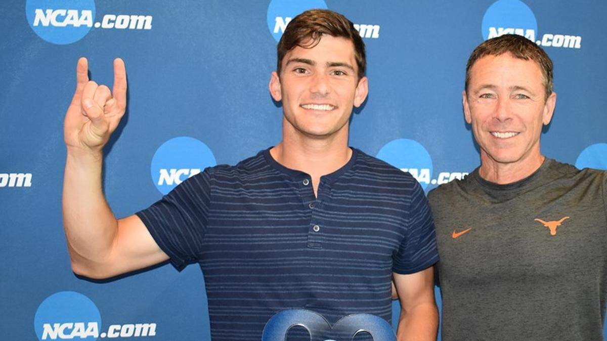 Johnny Goodwin, left, with Longhorns interim coach Bruce Berque, at Wednesday’s awards banquet in Orlando.