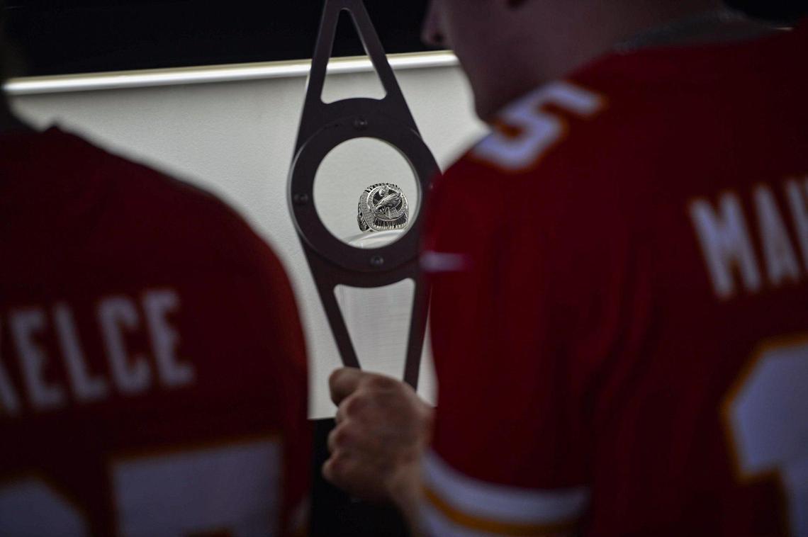 Fans used a magnifying device to view Super Bowl rings at the NFL Draft Experience Thursday, April 27, 2023, at the National WWI Museum and Memorial in Kansas City.