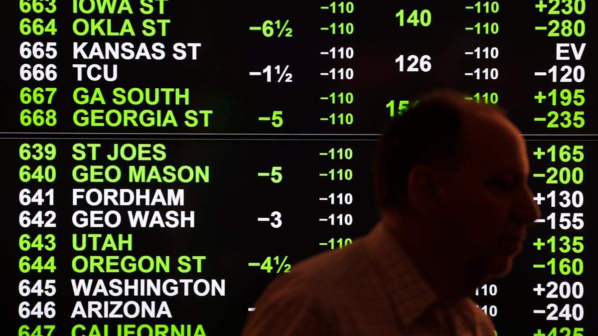 Odds for college basketball are shown during the launch of legalized sports betting in Michigan on March 11, 2020, at the MGM Grand Detroit casino sports book in Detroit. Kansas lawmakers are nearing the finish line on sports betting legislation.