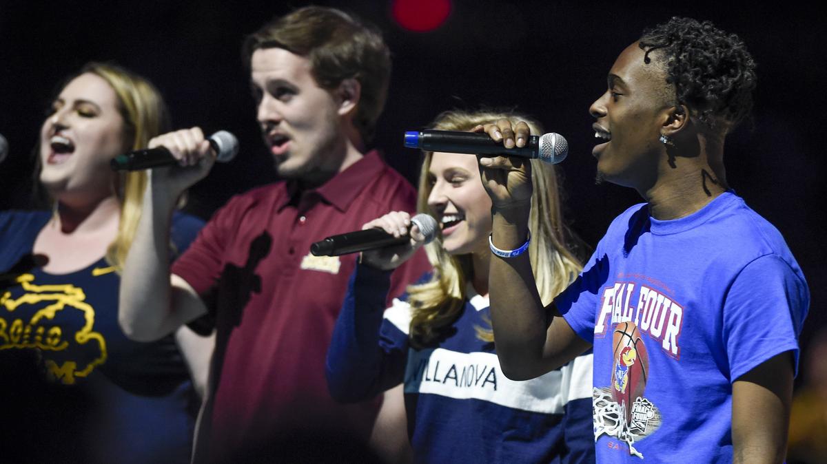 Darius Sheppard (right), KU sophomore majoring in vocal performance from Bonner Springs High School, joined Villanova's Maura Gownley, alto, Loyola Chicago's Andrew Mahlan, bass, and Michigan's Kayleigh Jardine, soprano, in singing the national anthem at the start of the Loyola Chicago-Michigan NCAA Final Four game on Saturday, March 31, 2018, in San Antonio, Texas.