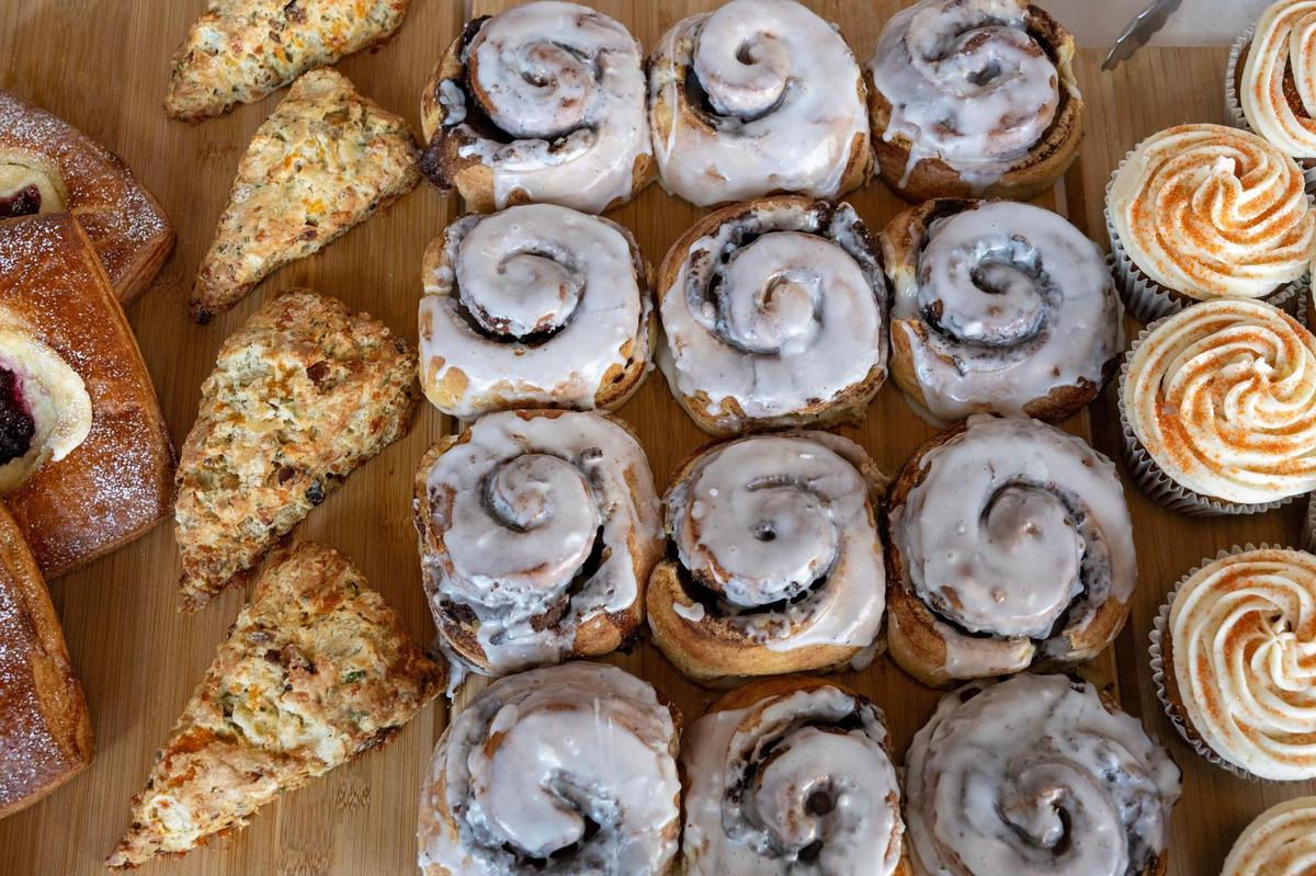 A variety of pastries are displayed on wooden boards behind a glass display case at Mildred’s on Thursday, Jan. 9, in Kansas City.