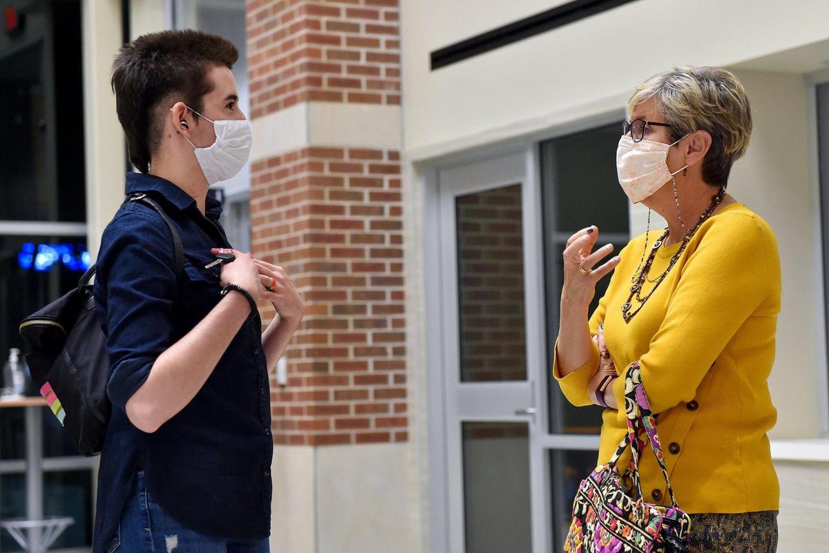 Zoe Dunning, left, talks with the Rev. Sally Haynes of Central United Methodist Church after a Blue Springs City Council meeting on Oct. 18. Haynes and Dunning, who is gender nonbinary and transgender, joined advocates who tried to persuade city leaders to ban conversion therapy as some other metro cities have done. The council has not taken any action.