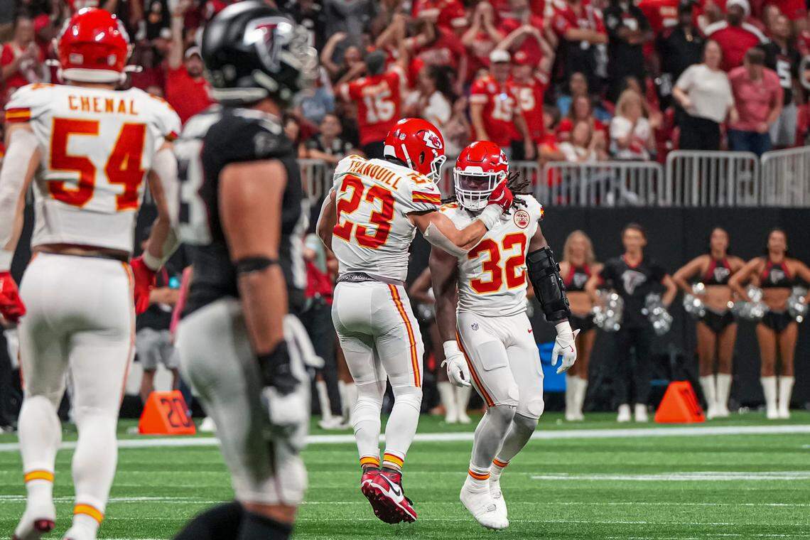 Chiefs linebacker Nick Bolton (No. 32) gets some love from teammate Drue Tranquill after stopping the Atlanta Falcons on fourth down to effectively seal KC’s Sunday night win at Mercedes-Benz Stadium.