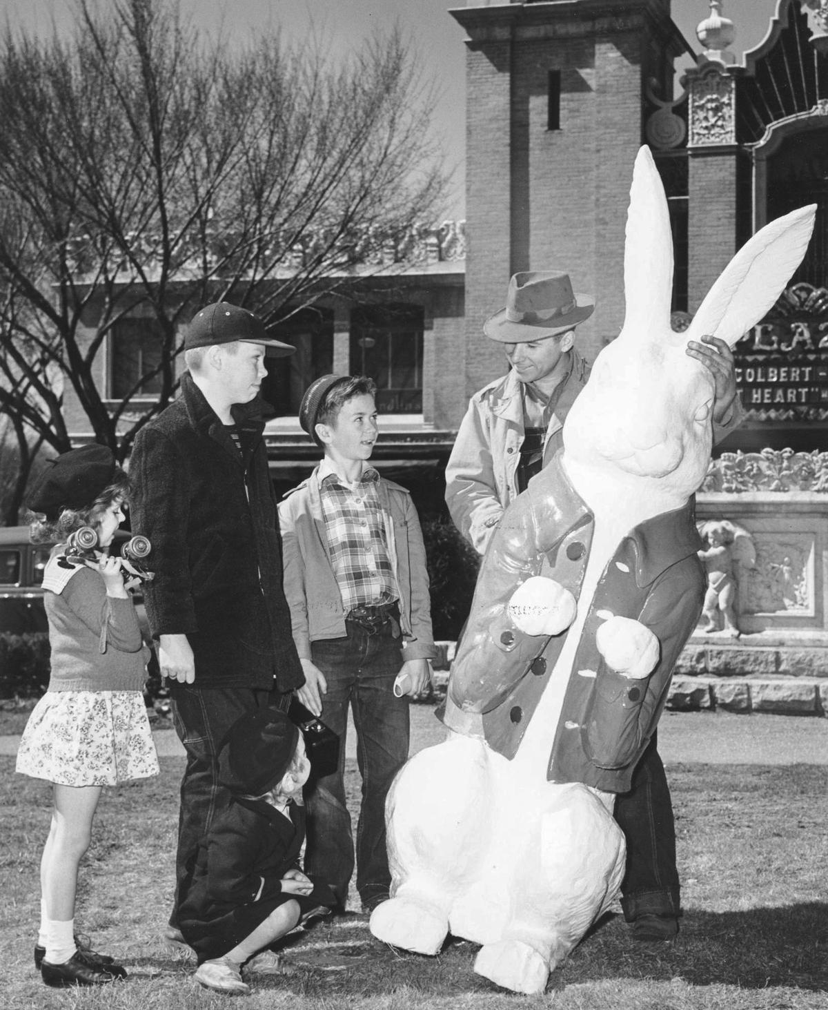 An Easter bunny is placed in the small triangular park in front of the Country Club Plaza Theater in 1951.