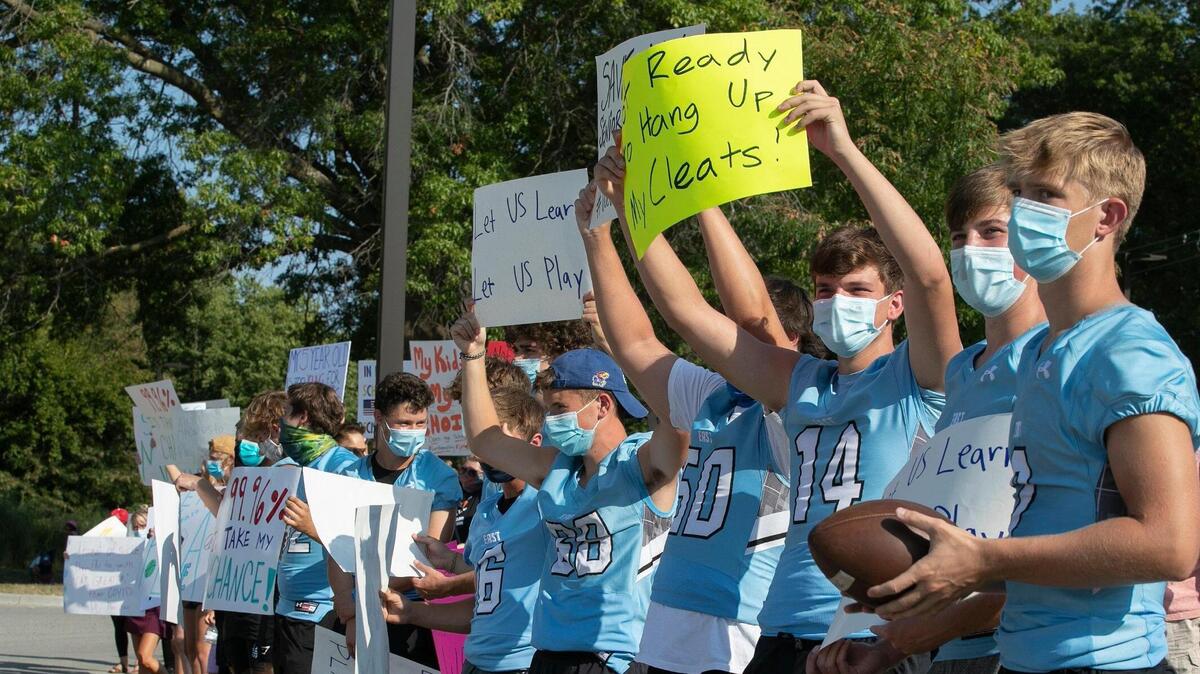 Parents and students protested outside Shawnee Mission’s Center for Academic Achievement in Overland Park last month, calling for in-person classes and the restart of sports.