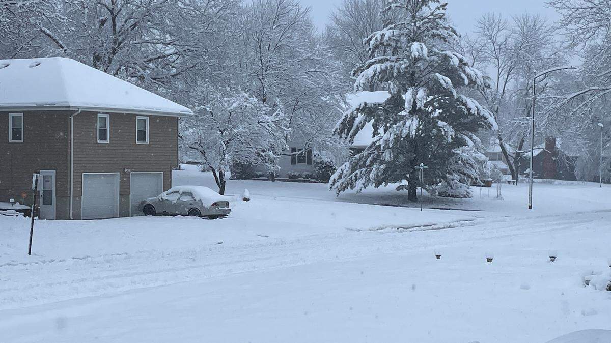 The neighborhoods in Grandview, located just south of Kansas City, received about six inches of snow overnight. By 9:30 a.m. Tuesday, thick and heavy snow continued to fall through the city, blanketing tree branches and utility power lines.