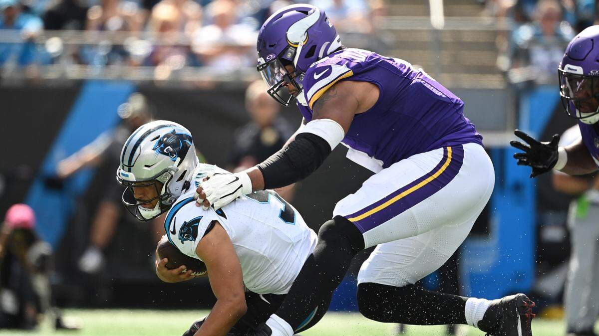 Minnesota Vikings linebacker Marcus Davenport (0) pressures Carolina Panthers quarterback Bryce Young (9) in the third quarter at Bank of America Stadium.