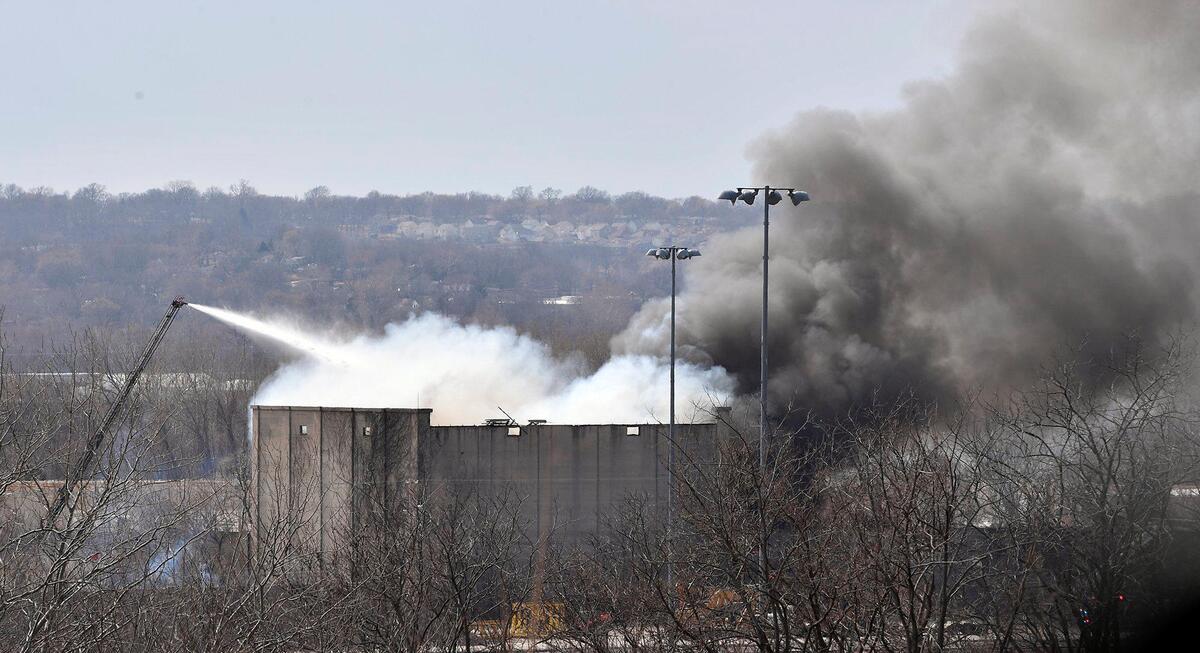 Firefighters battle a warehouse fire at 451 South 26th Street in Kansas City, Kansas
