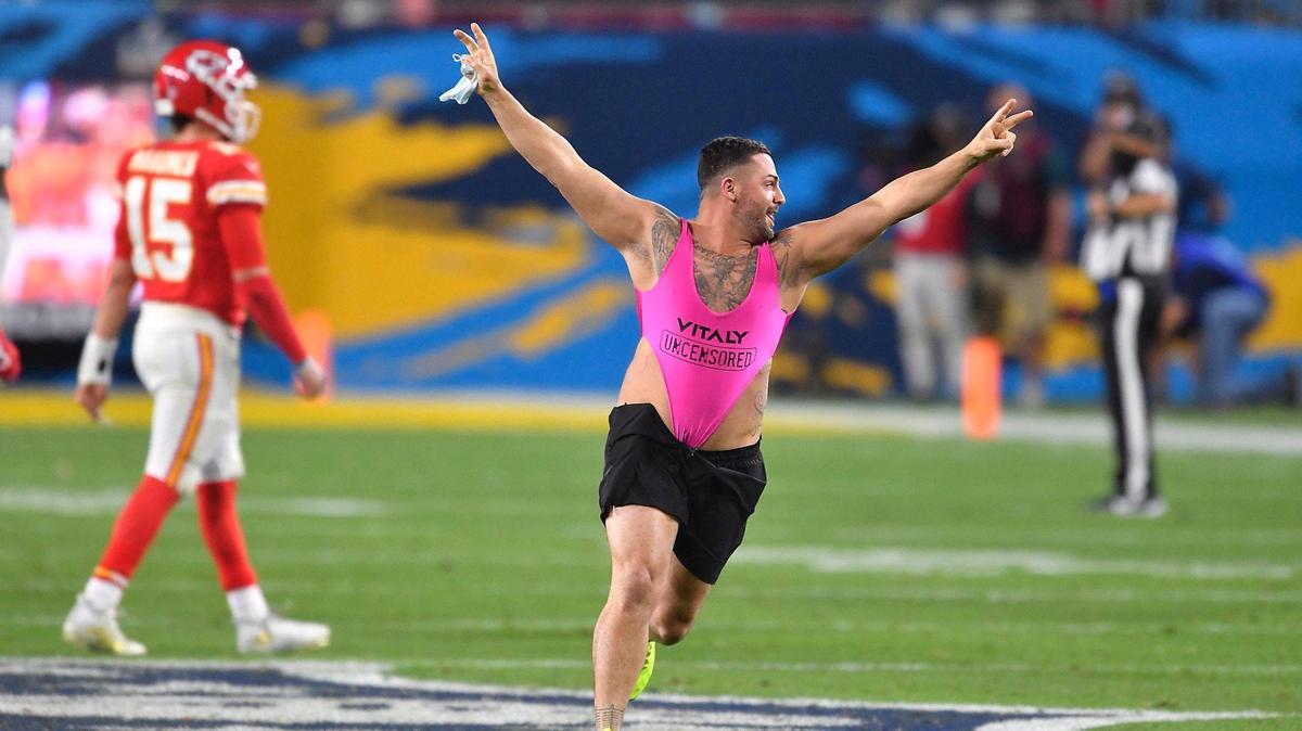 A fan runs onto the field near the end of the game Sunday, February 7, 2021, at Super Bowl LV at Raymond James Stadium in Tampa, Florida.