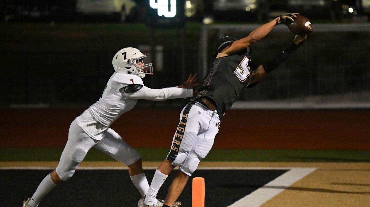 Lee’s Summit High School sophomore Karsten Fiene snares a pass against Park Hill during their football game on Friday night.