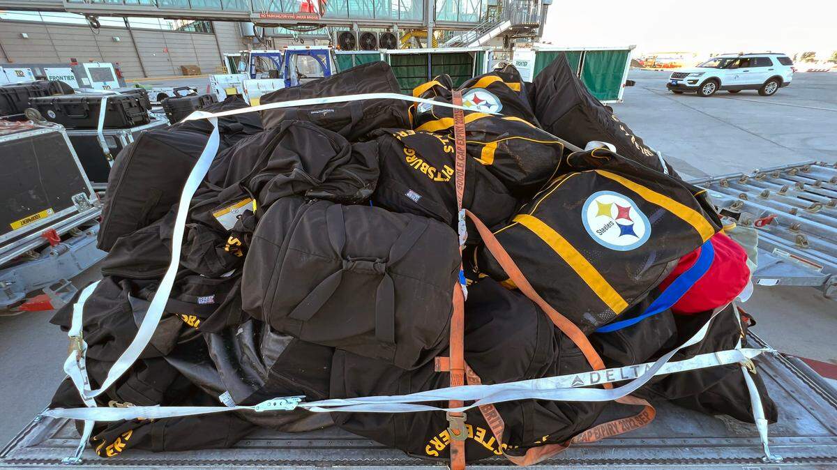 The Pittsburgh Steelers’ chartered flight was diverted after experiencing an in-flight engine problem and made an emergency landing at Kansas City International Airport early Monday. The team waited aboard the aircraft while a replacement plane was flown in. Luggage waited on carts for the new plane to arrive.