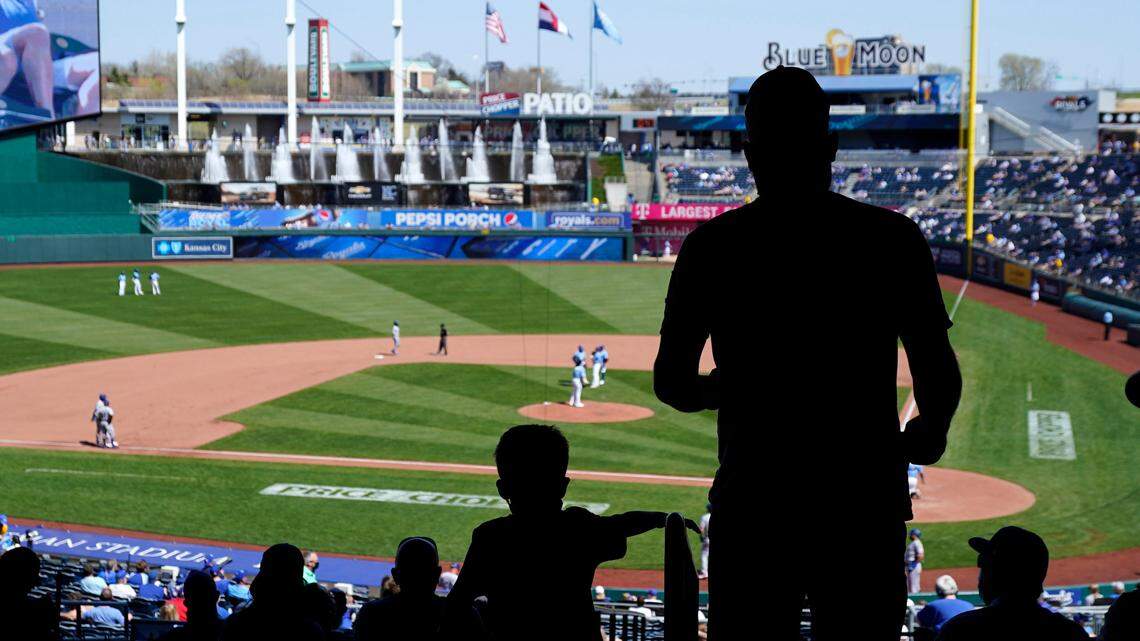 Kansas City Royals fans take their seats before the fourth inning against the Texas Rangers at Kauffman Stadium on April 4, 2021.