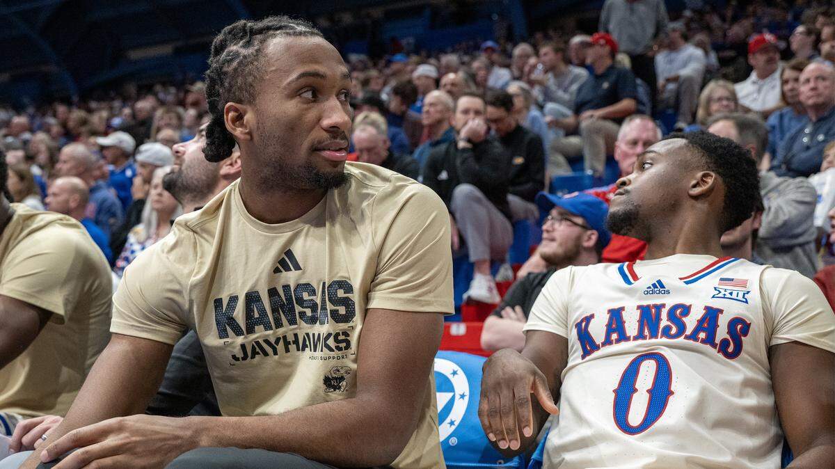 Kansas Jayhawks guard Darryn Peterson (22) and Kansas Jayhawks guard Nginyu Ngala (0) on the bench in the second half at Allen Fieldhouse on Tuesday, November 11, 2025, in Lawrence. Peterson did not play because of a tight hamstring.