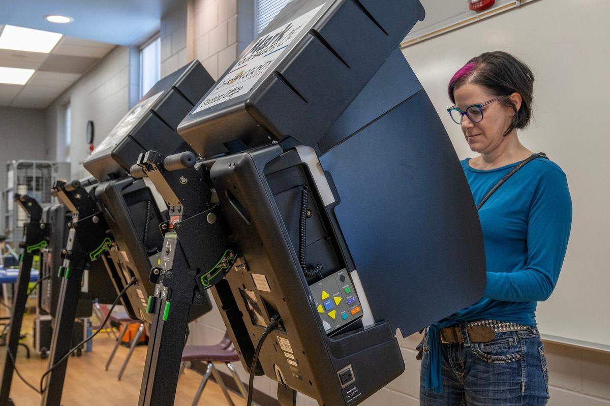 Julie Rohr casts her ballot at Blue Valley Recreation Center in Overland Park on Tuesday, Nov. 7.