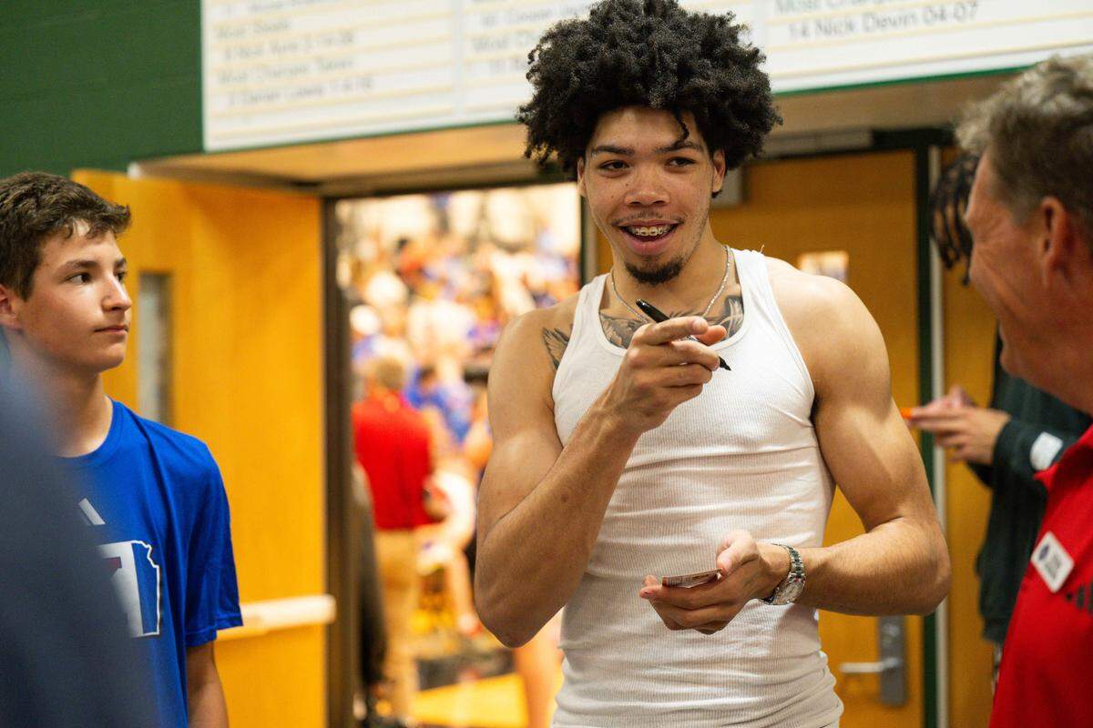 Kansas Jayhawks incoming freshman men’s hoops player Tyran Stokes signs autographs during the Rock Chalk Roundball Classic at Free State High in Lawrence, Kansas on Thursday, June 4, 2026.
