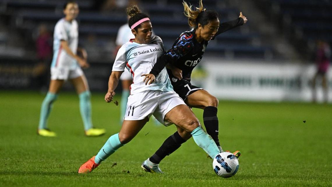 Kansas City Current midfielder Desiree Scott (No. 11) battles a Red Stars player for the ball during Wednesday night’s NWSL match in Chicago.