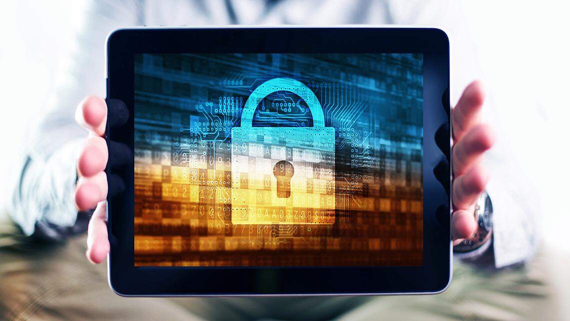 Internet User Protection Concept Photo. Men Showing Tablet Computer Mobile Device with Internet Security Concept Illustration on the Display. Safety in the Internet.