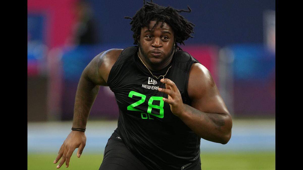 Offensive lineman Armand Membou runs through drills during the 2025 NFL Scouting Combine at Lucas Oil Stadium in Indianapolis on Sunday, March 3, 2025.