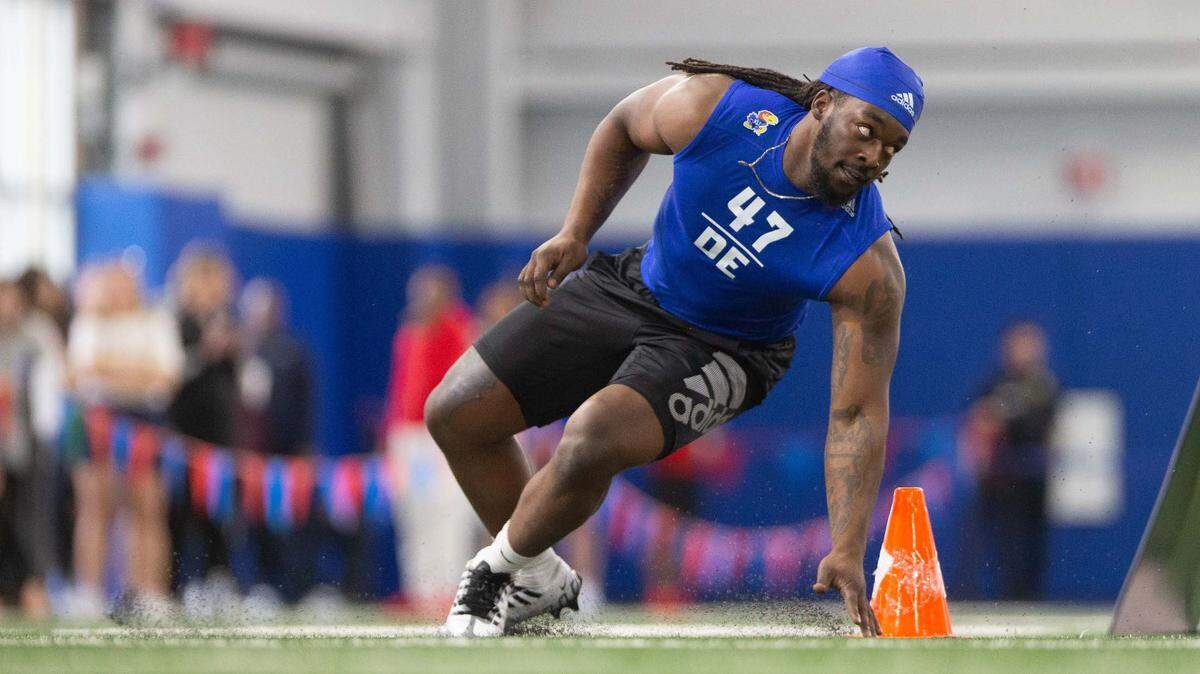 Former Kansas DE Lonnie Phelps Jr. (47) is timed on a shuttle drill during the 2023 KU football pro day at the Jayhawks’ indoor practice facility.